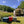 Anwendung Camping mit AEROSTUFFY Box M rot, blau und grau vor einem Zelt